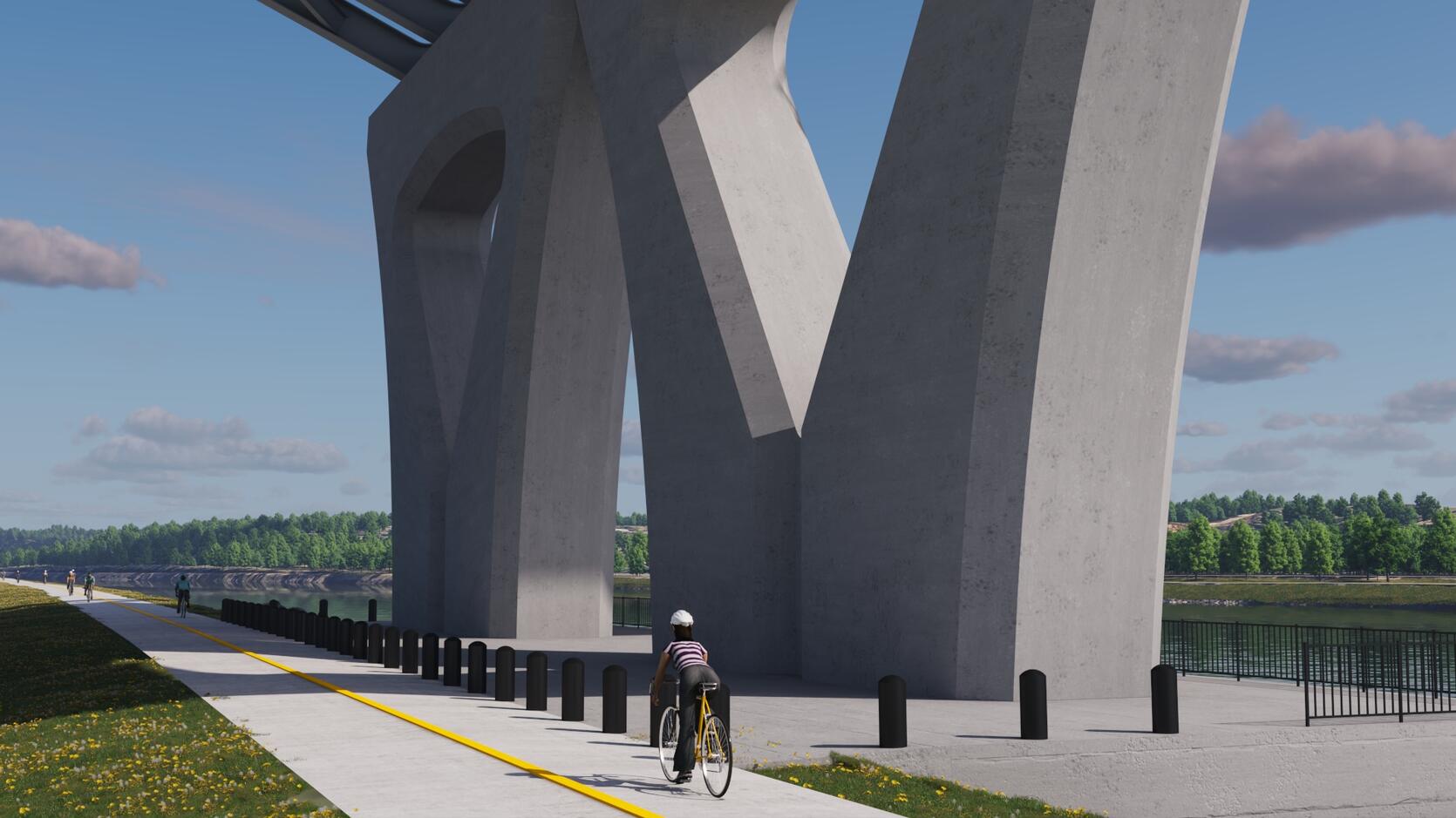 A cyclist rides the Canal Service Road path beneath the tall V-shaped concrete piers of the new Sagamore Bridge.